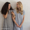 Two women wearing companion bracelets