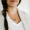 Woman wearing Laden druzy stone gold necklace