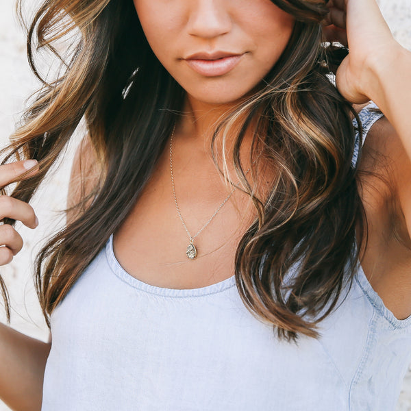 Woman wearing Honey druzy stone gold necklace