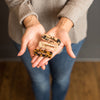 Woman holding three adorn hair clips