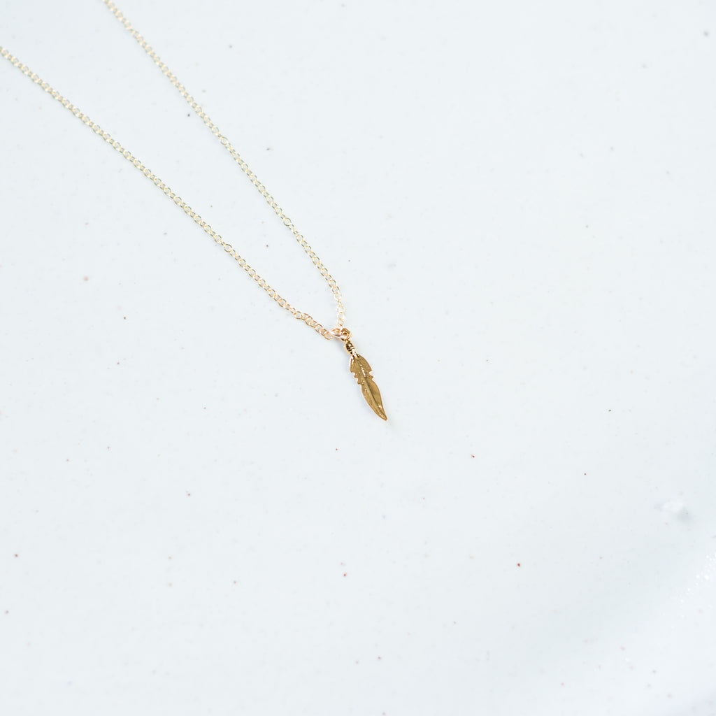 Plume gold feather necklace