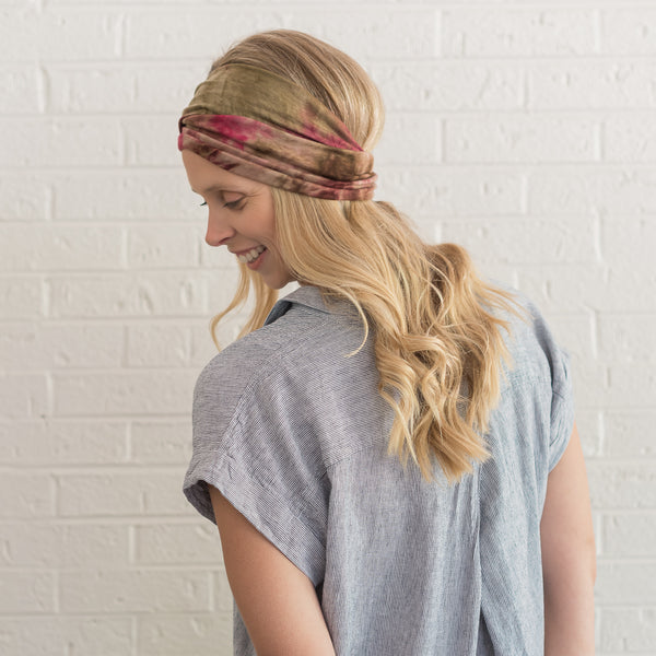 Woman wearing pink and green adorn headband