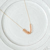 Onward gold necklace with brass fishtail chain