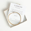 Gold carried bracelet and verse card