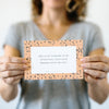 Woman holding scripture verse card Promise Pack