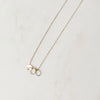 Gold necklace with charms