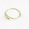 Gold carried bracelet with charm